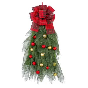 Festive Christmas teardrop swag with green mesh, red plaid bow and colorful baubles