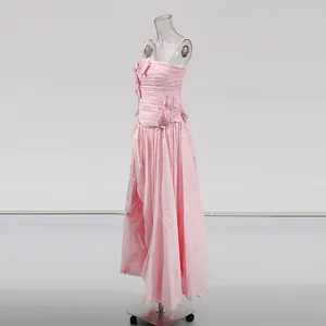 Detailed side view of pink dopamine slip dress featuring 3D floral appliques and asymmetrical slit