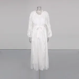 Elegant white mercerized long dress with pleated ruffles and waist-tie detail