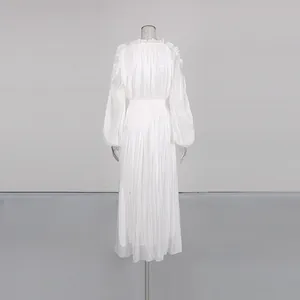 Detailed back view of an elegant white pleated maxi dress featuring balloon sleeves
