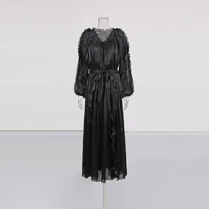 Detail of French style black mercerized long dress with ruffle trim on a mannequin