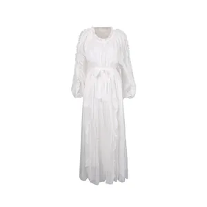 Detailed view of elegant white pleated maxi dress with silky finish and waist tie design