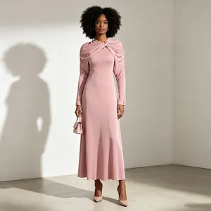 Elegant dusty pink maxi dress featuring a unique twisted cape-like neckline and slim fit
