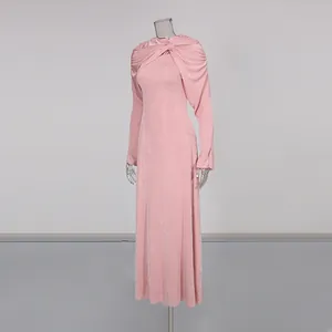 Detail view showing the elegant twist shawl collar and fabric texture of a pink slim-fit maxi dress.