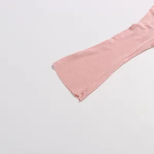 Close-up of elegant pink long sleeve cuff detail on a slim-fit dress.
