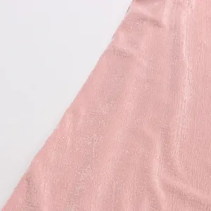 Detailed macro view showing the soft pink elastic fabric texture for a vintage elegant dress