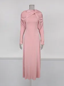 Elegant pink slim-fit long-sleeved dress with a vintage twisted shawl collar design.
