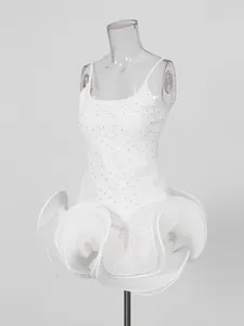 Elegant white French style sleeveless rhinestone dress with voluminous pleated ruffle hem