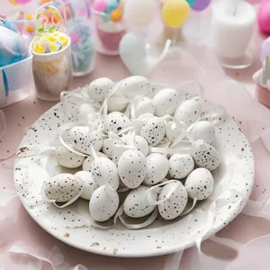 Close-up of 24 speckled Easter eggs with white ribbons displayed on a textured plate.