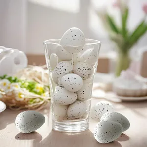 Detailed view of white speckled Easter eggs in a clear glass for festive party decoration