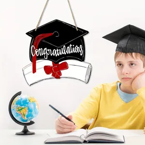 Wooden graduation cap sign hanging decoration shown in a festive classroom study scene
