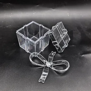 Exploded view of transparent PS plastic gift box showing base, lid, and bow detail