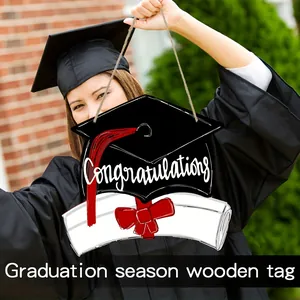 Graduation season wooden hanging tag with Congratulations held by a student in gown