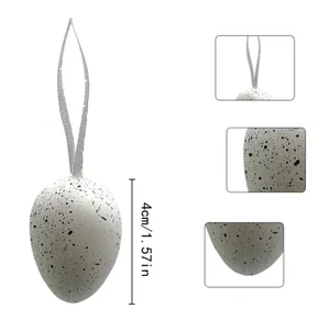 Macro detail of speckled white Easter egg decoration showing 4cm or 1.57 inch height dimension