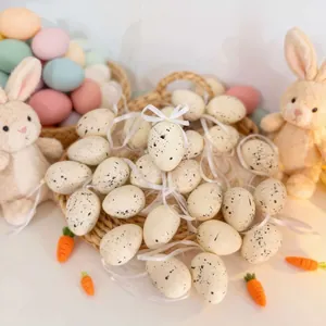 High-definition close-up of speckled Easter eggs featuring white satin ribbons and bows.