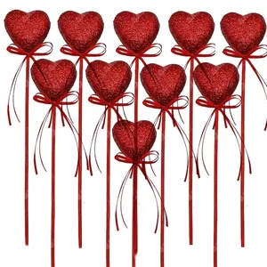 Set of red glitter foam heart picks with ribbon bows for Valentine's Day decoration