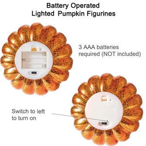 Bottom view of LED pumpkin light showing 3 AAA battery compartment and power switch