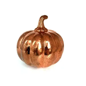 Macro view of metallic copper mercury glass pumpkin ornament with rustic finish