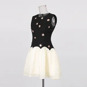 Side view detail of a vintage French style sleeveless dress with metallic flower sequins