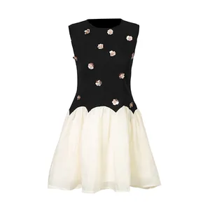 Detailed view of a French vintage sleeveless dress featuring metallic flower accents