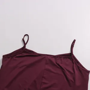 Close-up view of adjustable spaghetti straps and neckline on a burgundy satin dress