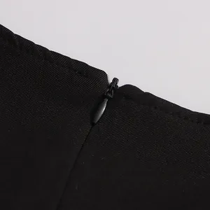 Detail shot of high-quality invisible zipper on the black French vintage dress.