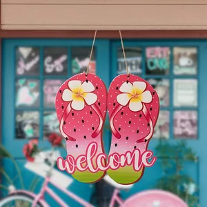 Decorative wooden flip-flop welcome sign with watermelon print and white floral details
