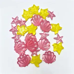 Detailed view of colorful reusable plastic ice cubes in seashell and starfish shapes