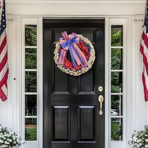 Patriotic Fourth of July burlap wreath with stars and stripes bow on a black front door