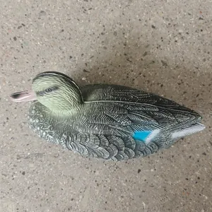 Detailed view of the realistic feather texture on a plastic teal hunting decoy