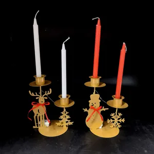 Vintage golden metal Christmas candle holders featuring reindeer, snowman, and LED string lights
