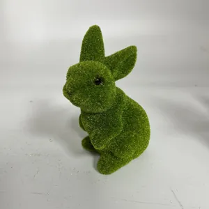 Detail view of a green flocked bunny ornament for festive Easter tabletop decoration