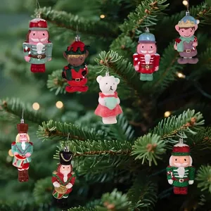 Detailed view of assorted Christmas tree ornaments including nutcrackers and elves