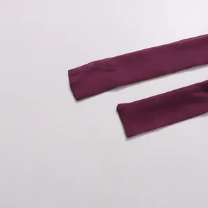 Macro detail view of deep purple chiffon neck tie straps for a vintage style dress.