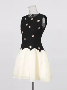 Elegant French retro sleeveless black and cream mini dress with metallic flower details