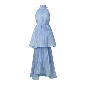 Detail view of a light blue pleated maxi dress with high neck and tiered skirt
