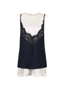 Elegante vestido sin mangas azul marino y blanco con delicado escote en V de encaje negro