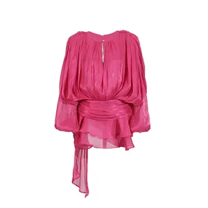 Detailed view of a fuschia long-sleeved mini dress with oversized sleeves and waist sash.
