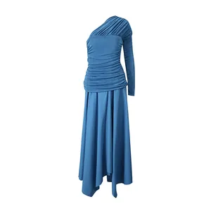 Detailed view of the deep blue one-shoulder dress featuring elegant pleated waist design