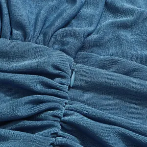 Close-up of invisible zipper and ruched fabric texture on deep sea blue summer maxi dress.