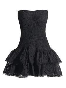Elegant black strapless bohemian dress with smocked bodice and eyelet ruffle skirt