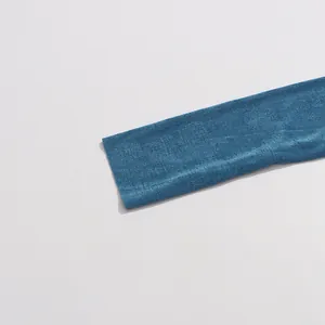 Detailed close-up showing the fine texture and deep sea blue color of the summer dress fabric