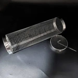 Close-up view of a stainless steel rolling BBQ grill basket with detachable lid and hook tool