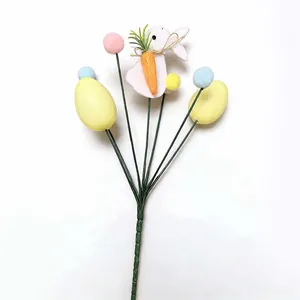 Detailed view of an Easter floral pick with pastel eggs and a bunny holding a carrot
