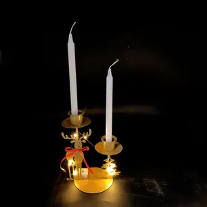Close-up of golden reindeer iron candle holder with warm LED fairy lights detail