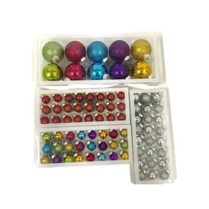 Detailed view of assorted glass Christmas ball ornaments in multiple boxes and colors