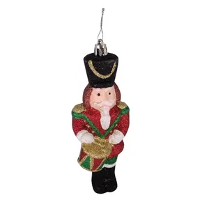 Close-up of a festive Nutcracker hanging ornament with shimmering glitter details.