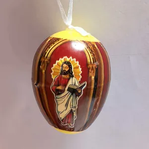Detailed close-up of a religious Easter egg hanging ornament with Jesus icon