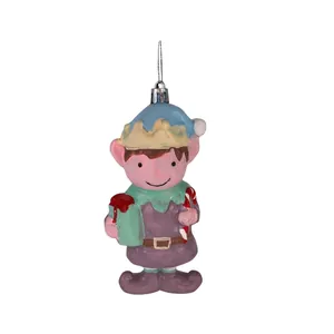 Detailed view of a hand-painted Christmas elf ornament holding a gift and candy cane.