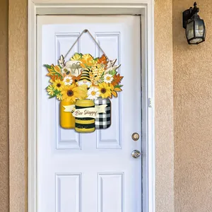 Rural farmhouse style wooden door hanger decoration with sunflowers and bees on a white front door
